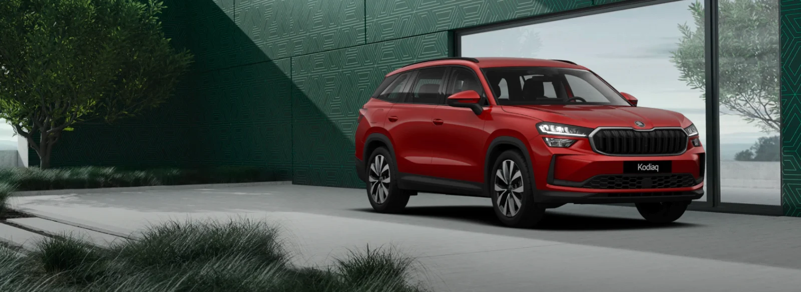 Škoda Kodiaq rouge Velvet devant la façade Škoda